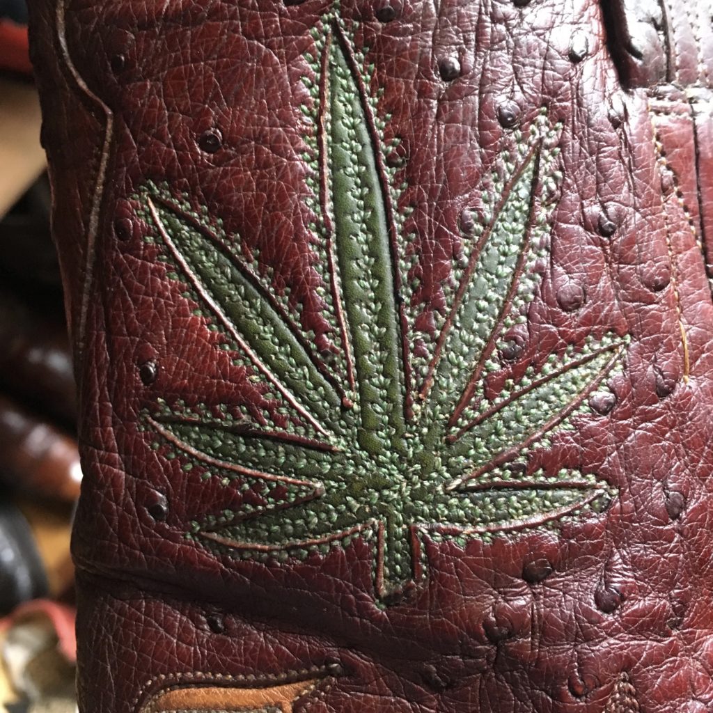 custom cowboy boot with pot leaf detail